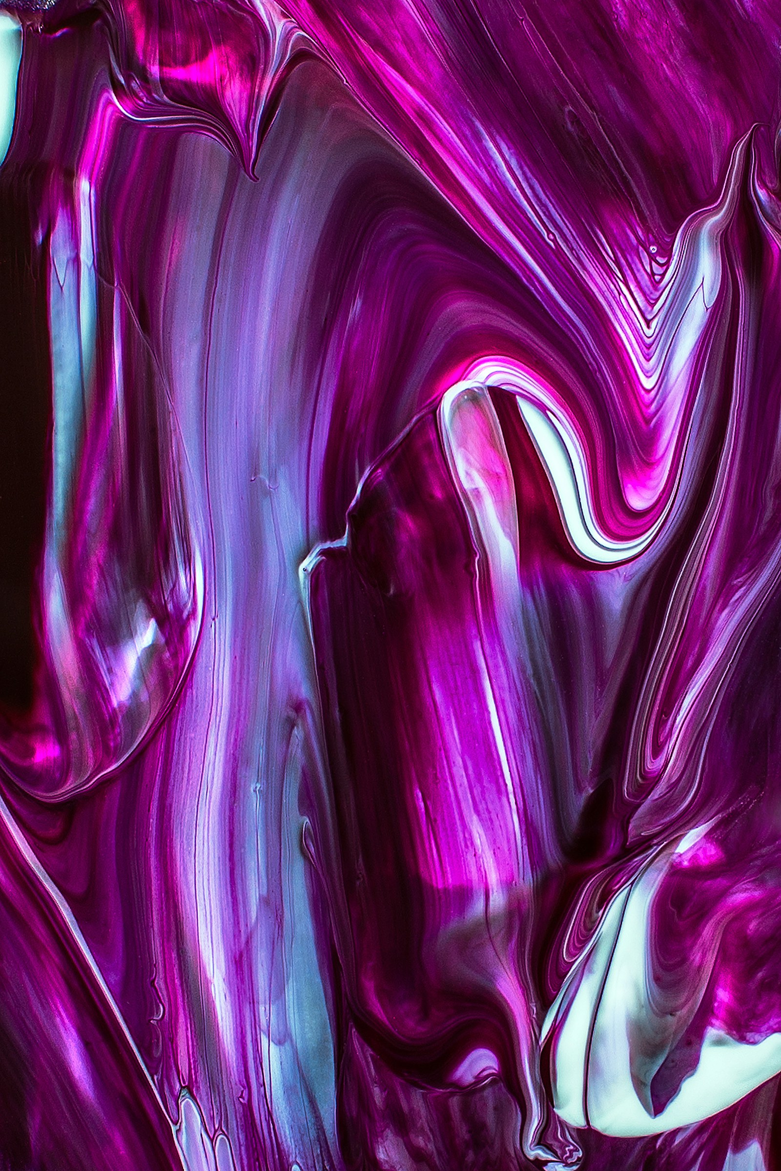 Colorful illuminated artwork in a dark gallery